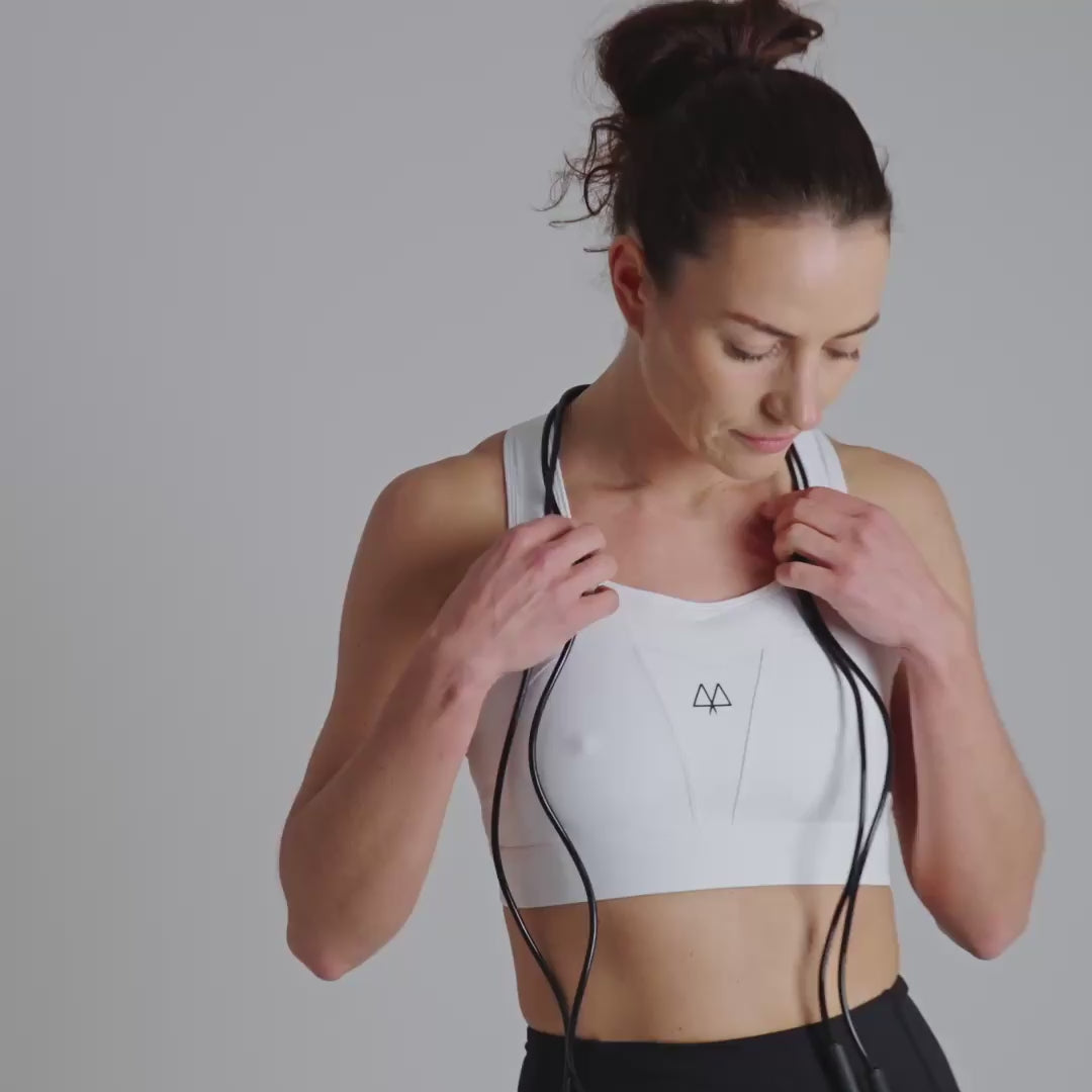 White sports bra with a MAAREE logo on a neutral background